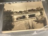 a picture of a bridge over a river in the middle of the day