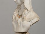 marble bust of a woman with a veil on her head