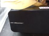 a microwave sitting on a counter with a banana on top of it