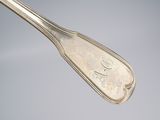 silverware spoon with the letter e on it and a silver spoon with the letter e on it