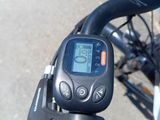 a close up of a bike ' s handlebar with a speedometer