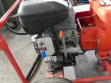 an image of a small engine on a cart