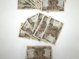 a group of five different bills with pictures of people on them