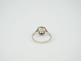 a close up of a ring on a white surface
