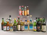 many different types of alcohol bottles in this picture