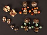 an image of a group of jewelry on a black surface
