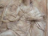 a statue of a woman holding a baby in her arms