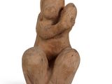 sculpture of a woman holding a child in her arms