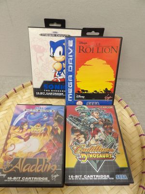three video games sitting on top of a basket on top of a table