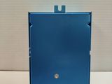 a close up of a small blue box on a white surface