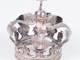 a silver crown with a cross on top of it