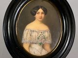 portrait of a woman in a white dress in a black frame