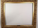 a gold framed mirror with a white background