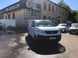 a white van that is parked in front of a building