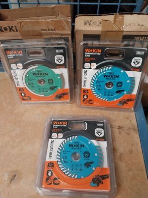 three different types of saw blades in boxes on a table