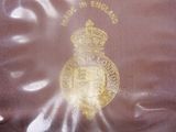 a plastic bag with a gold emblem on it