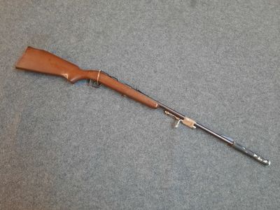 a rifle that is laying on top of a table