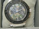 a picture of a watch in a box with a camouflage dial