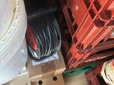 a stack of boxes and a box with a hose in it