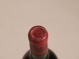 a bottle of wine that is sitting on a table