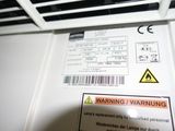 a warning sign on the back of a refrigerator door