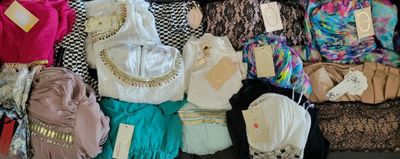many different types of clothing on display in a store