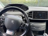 a steering wheel and dashboard of a car in a car showroom