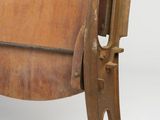 a wooden chair that has a wooden seat on it