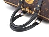 a close up of a louis vuitton bag on a white surface