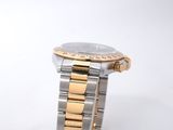 a close up of a wrist watch on a white surface