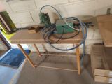 a picture of a workbench with a drillet on top of it