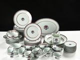 a lot of plates and cups sitting on a table