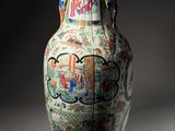 a vase that has a picture of a man and a woman on it