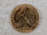 l'image d'une pièce d'or ornée d'un coq