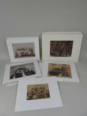 four old black and white photographs of a group of people