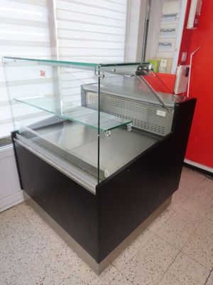 a glass display case in the middle of a room