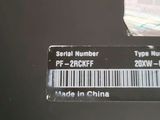 a close up of a serial number sticker on a laptop