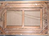 a picture of an old window with a rope hanging from it