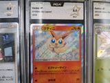 a lot of pokemon cards on display in the store