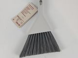 a close up of a broom with a tag on it