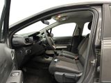 the interior of a car with the door open showing the driver ' s seat