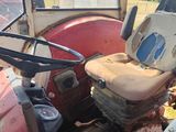 a tractor that is sitting in the dirt