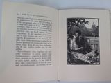 an open book with a picture of a man and a woman sitting on a bench