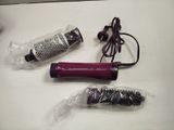 a hair dryer and a blow dryer sitting on a table