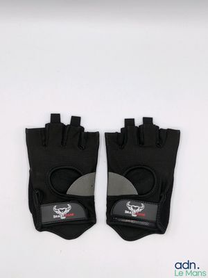 a pair of black and grey gloves on a white surface
