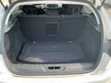 a trunk of a car with the back seats folded down