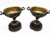 pair of antique brass and black marble urns on pedestals