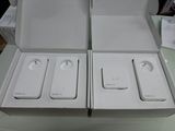 two white boxes that are open on top of a table