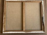 a close up of a picture of a window with a brown frame