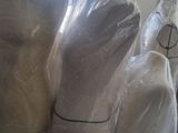 several mannequins are wrapped in plastic in a room